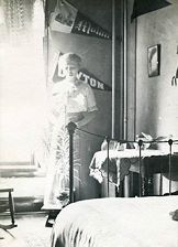 Woman standing in dorm room 