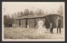 Ben Miller family outside of sod house