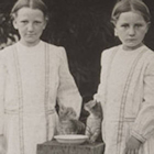 Alice Nelson and Mildred Nelson outside with two kittens
