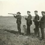 Four men with shotguns 
