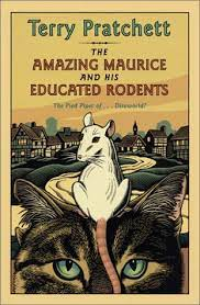 the cover of The Amazing Maurice and his Educated Rodents by Terry Pratchett.  A white rat with red eyes sits on top of a tabby cat. Both are staring intently at the viewer.