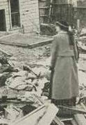 Woman Standing in a Pile of Rubble